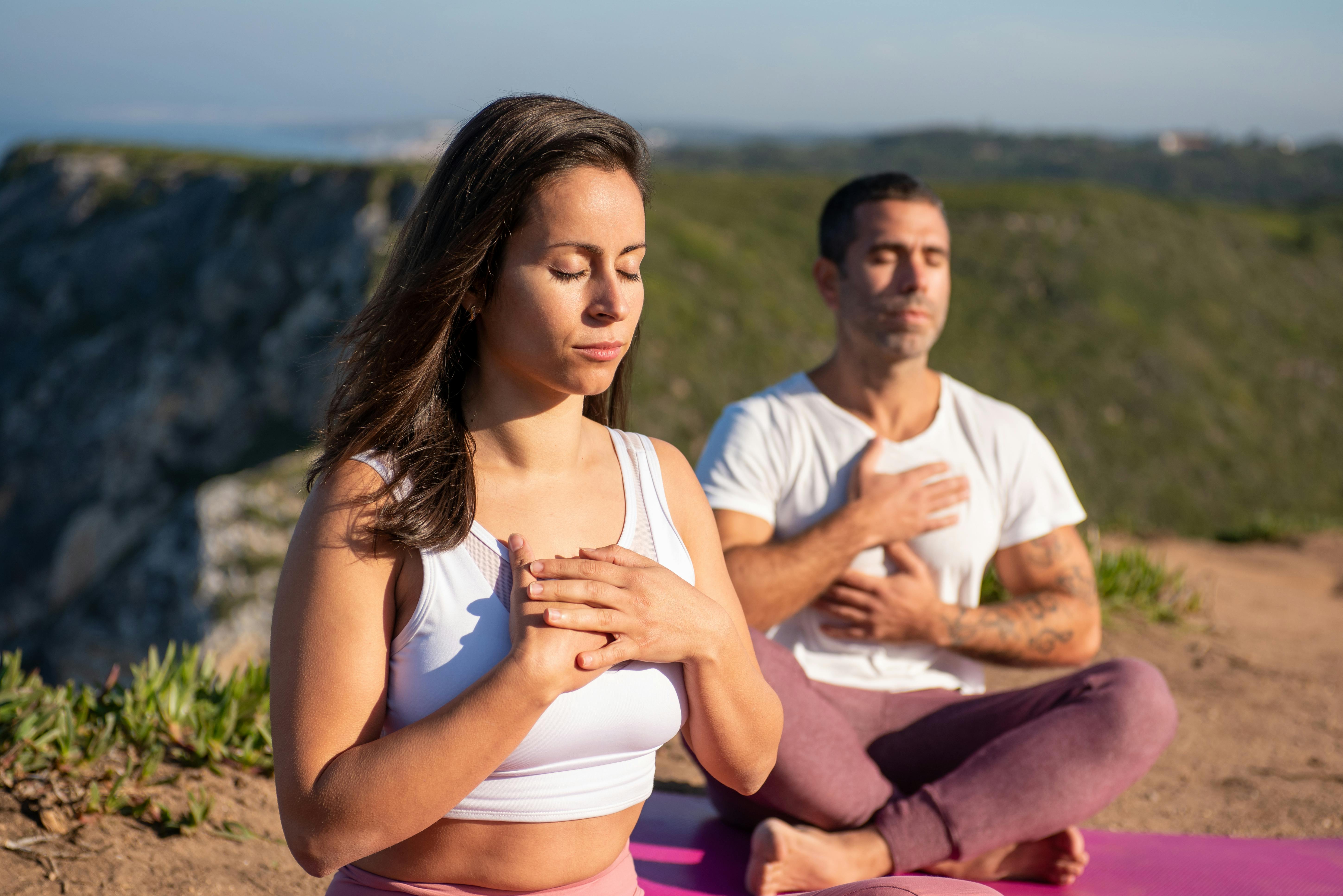Woman practicing breathing exercises outdoors